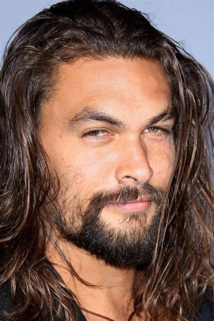 Jason Momoa's Arthur Curry from the Aquaman poster superimposed over a poster for The Marvels
