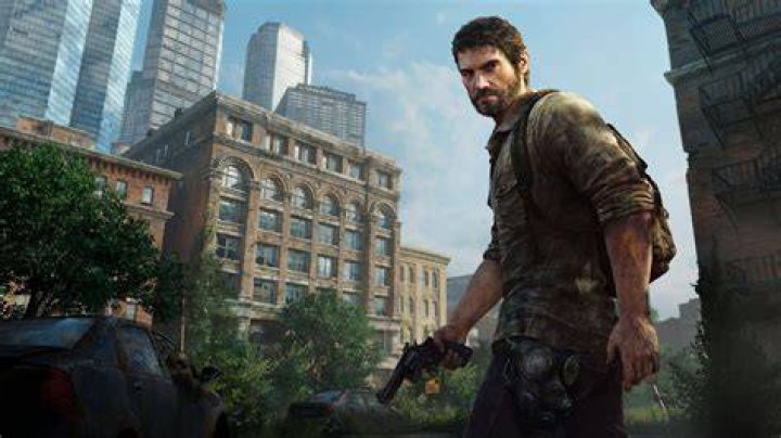 Joel is holding up a flashlight in The Last of Us.
