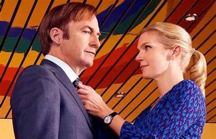 Kim Wexler adjusts Jimmy McGill's tie in their shared law offices.