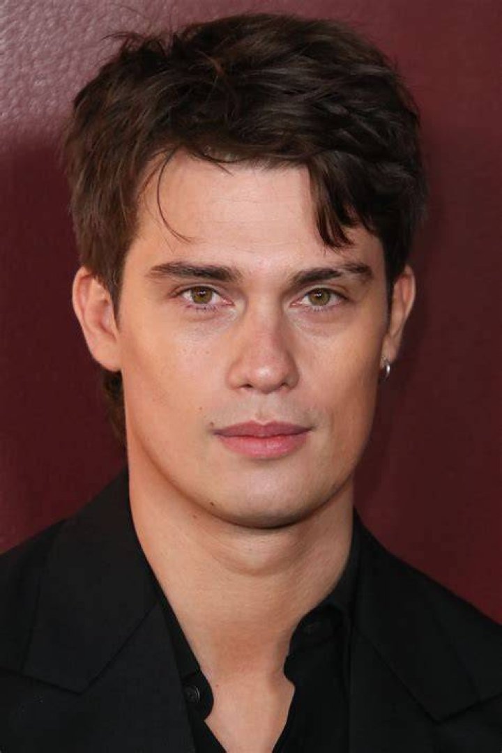 Nicholas Galitzine's character Luke in army uniform kissing Sofia Carson's character Cassie