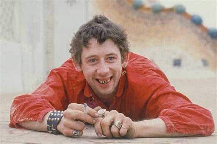 Photo of POGUES and Shane MacGOWAN, Shane MacGowan performing on stage (Photo by Matt Kent/Redferns)